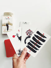 Iching deck and hand holding cards