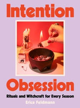 purple cover with red letting and a cauldron and candles 