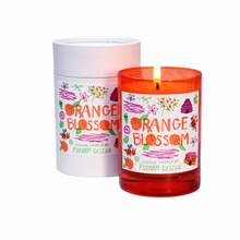 orange glass candles wiht oranges beehives, and home illustrated in an orange blossom scent 