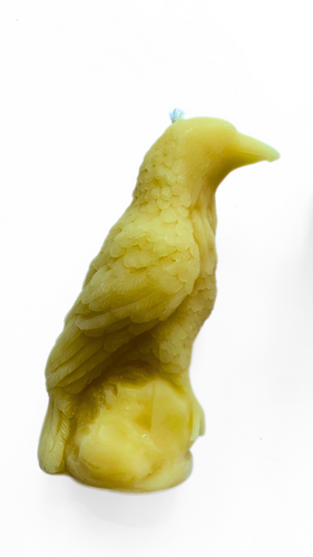 4-inch tall carved beeswax crow candle, featuring intricate details and a warm, natural texture, perfect for adding a mystical touch to any space.