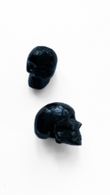 Pocket Sized Black glass skull featuring a pentacle design etched into it