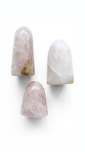 three crystal rose quartz standing bloops or ghosts with no eyes