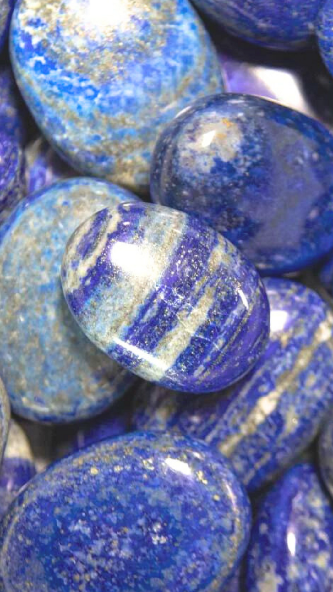 Lapis Lazuli palm stones. Dark blue with white stripes and gold specs
