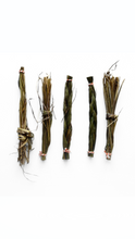 Five sweet grass braids
