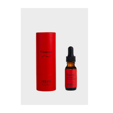 A red bottle of passion essential oil with dropper by Helias